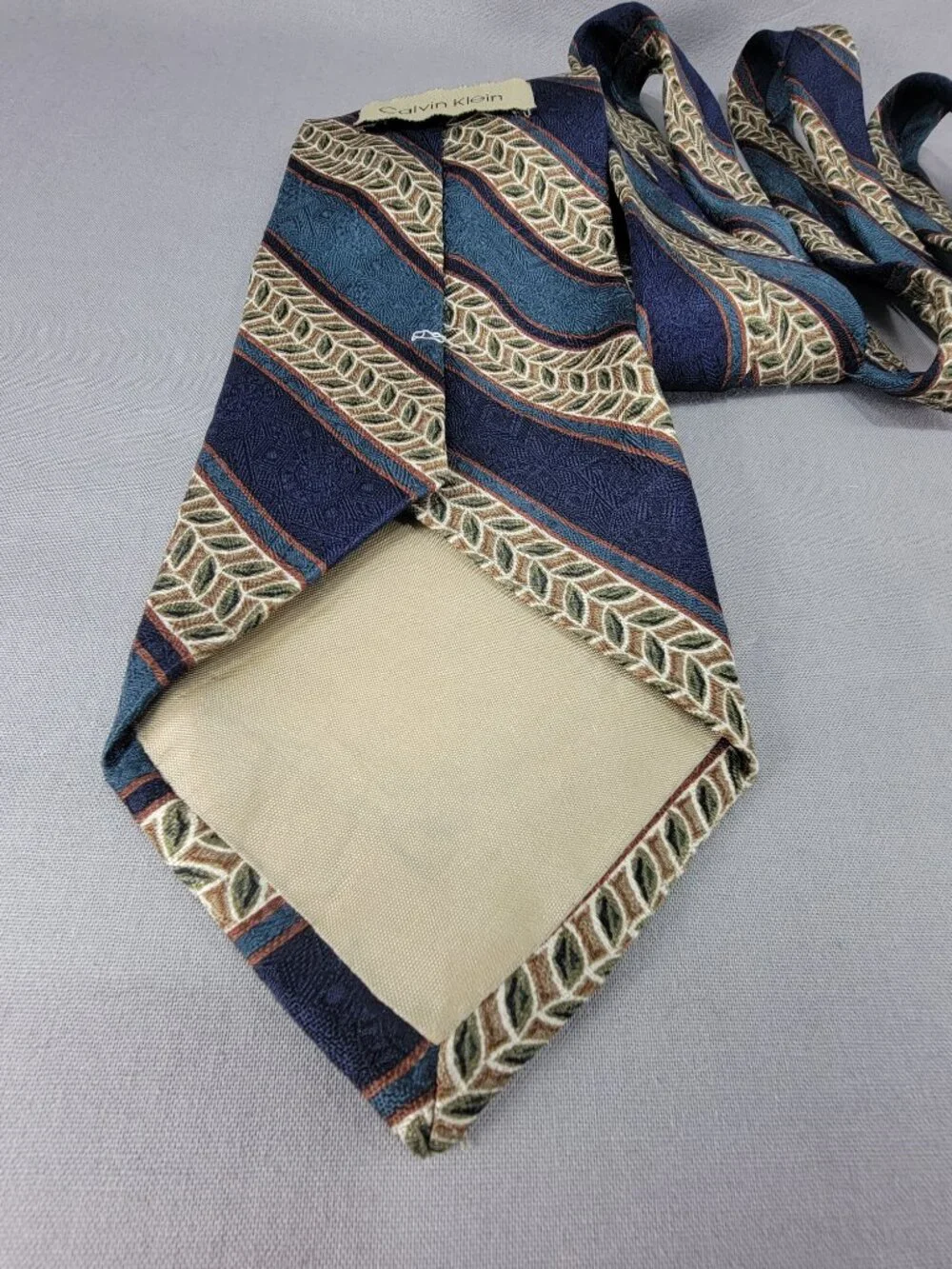 Calvin Klein Silk Necktie Tie Mens Blue Tan Stripe Leaf Geometric USA